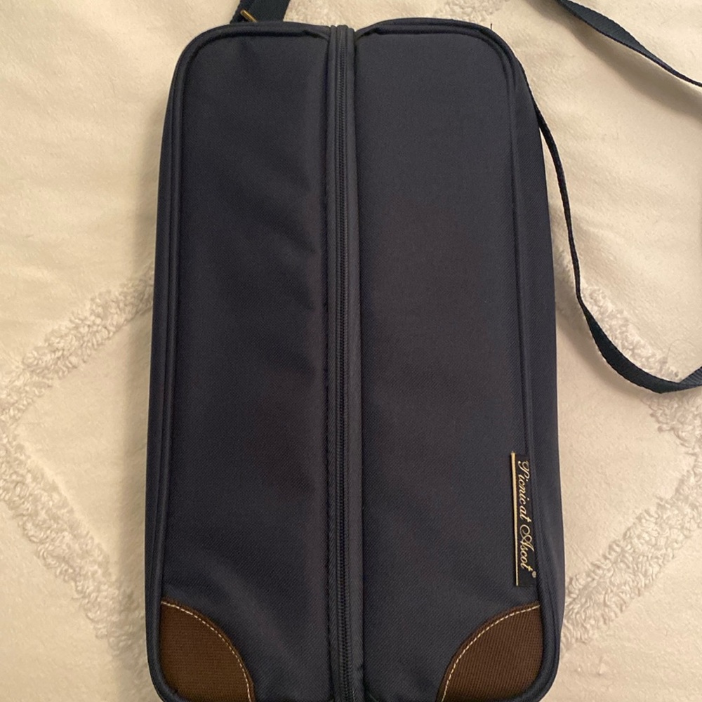Insulated wine carrier with wine glasses.